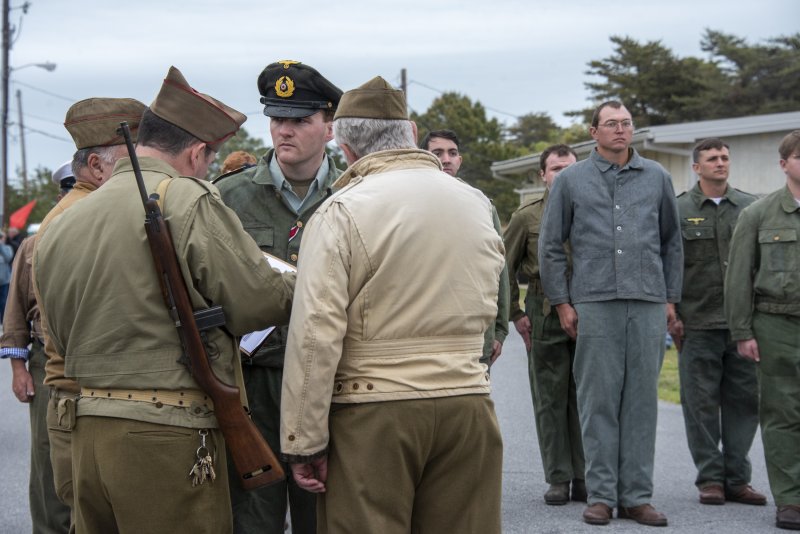 Reenactors of German submarine soldiers are processed during Fort Miles Defense Day.